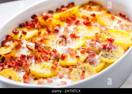 baked potatoes with bacon and eggs Stock Photo