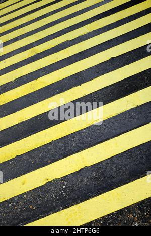 yellow painted stripes on concrete steps Stock Photo