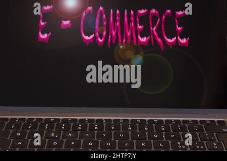 concept of e-commerce with  a keyboard and the phrase on the backgorund Stock Photo
