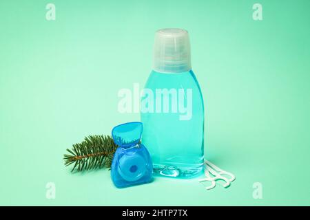 Concept of tooth care on mint background Stock Photo