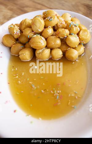 pignolata typical Sicilian and Calabrian dessert that is prepared for carnival Stock Photo