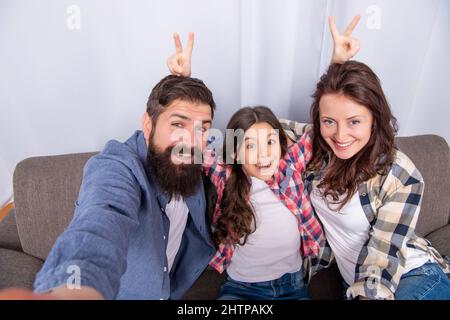 mom dad and daughter love relax together. adoption and charity. family day. friendship. Stock Photo