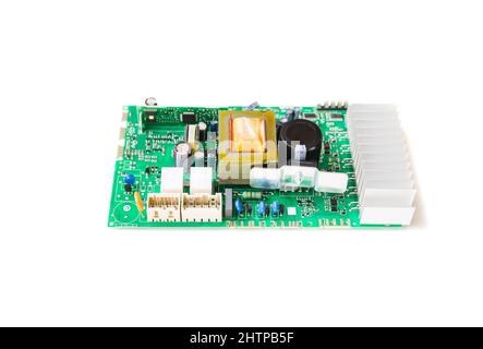 Electronic circuit board of washing machine isolated in white background. Stock Photo