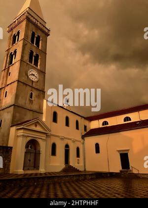 The majestic church of the Annunciation of the Blessed Virgin Mary in Mali Losinj, a popular tourist destination. Christian old basilica church in Mal Stock Photo