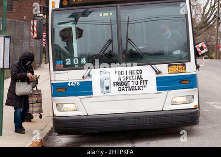 DO I NEED A SPECIAL FRIDGE? A quirky funny irreverent Oatly oat milk ad on the front of a New York City bus in Flushing, Queens New York City. Stock Photo