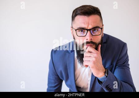 Portrait of businessman who is thoughtful and worried. Copy space on image for your text or advert. Stock Photo