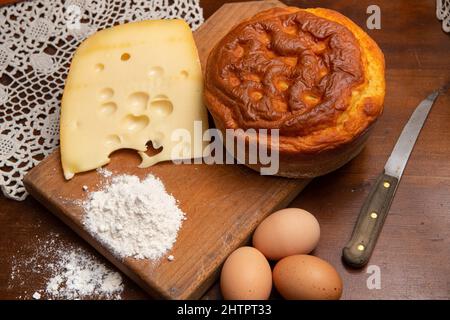 Easter breakfast in Italy whit Colomba cake and little chocholat eggs on wooden surface Stock Photo
