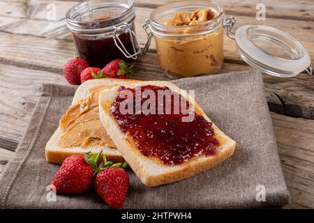 Jar and knife with creamy peanut butter on white background Stock Photo by  ©NewAfrica 193150800