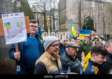 Cork, Ireland. 2nd Mar, 2022. Around 100 people gathered in Bishop Lucey Peace Park in Cork city today, in solidarity with the people of Ukraine. The Cork Lore Mayor, Cllr. Colm Kelleher, laid a wreath and tied a ribbon to the gates of the park. Credit: AG News/Alamy Live News Stock Photo