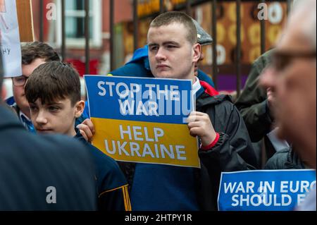 Cork, Ireland. 2nd Mar, 2022. Around 100 people gathered in Bishop Lucey Peace Park in Cork city today, in solidarity with the people of Ukraine. The Cork Lore Mayor, Cllr. Colm Kelleher, laid a wreath and tied a ribbon to the gates of the park. Credit: AG News/Alamy Live News Stock Photo