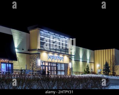 New Hartford, New York - February 28, 2022: Night View of Snagertown Mall Main Entrance. Sangertown is the Biggest Mall in Oneida County with Numerous Stock Photo