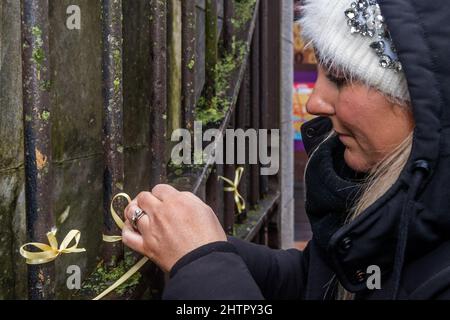 Cork, Ireland. 2nd Mar, 2022. Around 100 people gathered in Bishop Lucey Peace Park in Cork city today, in solidarity with the people of Ukraine. The Cork Lore Mayor, Cllr. Colm Kelleher, laid a wreath and tied a ribbon to the gates of the park. Credit: AG News/Alamy Live News Stock Photo