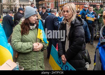 Cork, Ireland. 2nd Mar, 2022. Around 100 people gathered in Bishop Lucey Peace Park in Cork city today, in solidarity with the people of Ukraine. The Cork Lore Mayor, Cllr. Colm Kelleher, laid a wreath and tied a ribbon to the gates of the park. Credit: AG News/Alamy Live News Stock Photo