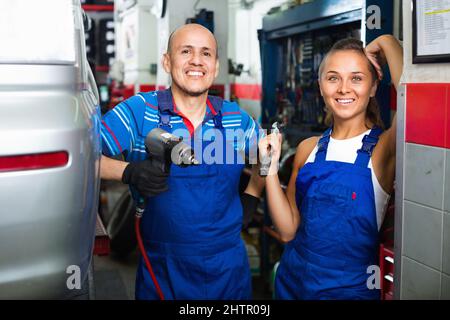 Portrait of two workers in protective overalls Stock Photo