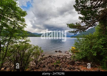 View of the Teletskoye lake in Gorny Altai, Russia, in the evening in cloudy weather. Siberian landscape Stock Photo