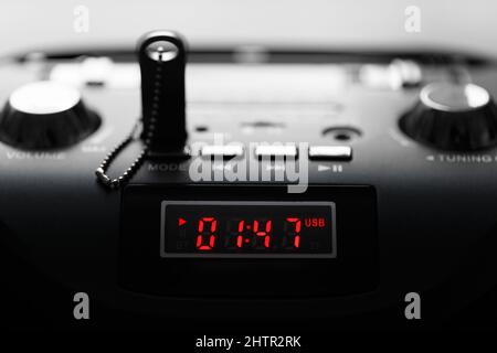 MP3 player panel with digital indicator. Dark key with shallow depth of field in backlight Stock Photo