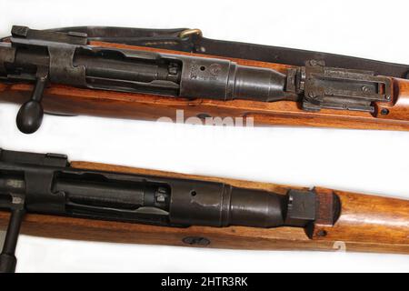 Two Versions of Japanese Arisaka Rifles from WW2. One with Imperial Mum removed and one with intact chrysanthemum Stock Photo