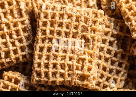 Healthy bite size whole wheat breakfast cereal biscuits high in dietary fiber. Stock Photo
