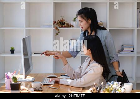 Business team discuss and offer idea the situation on the investment in the stock market. teamwork working together at friendly staff corporate Stock Photo