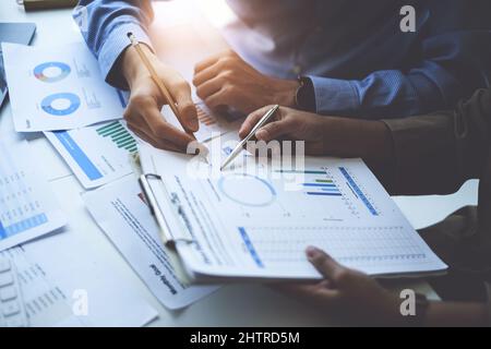 Group of Business people and Accountant checking data document on digital tablet for investigation of corruption account . Anti Bribery concept. Stock Photo