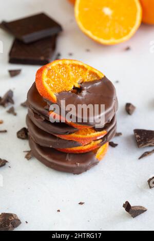 Stacked chocolate dipped candied orange slices. Stock Photo