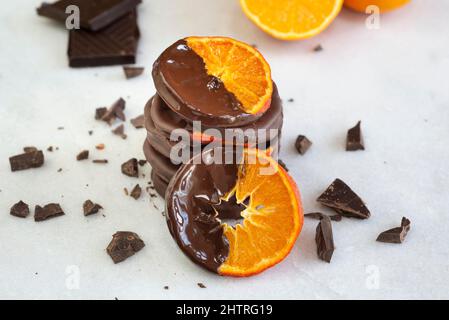 Stacked chocolate dipped candied orange slices. Stock Photo