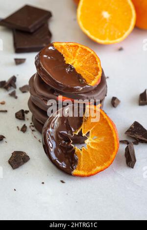 Stacked chocolate dipped candied orange slices. Stock Photo