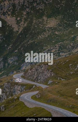 Empty paved mountain road winding through the landscape. Stock Photo