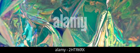 Teal colored glossy defocused hologram banner. Crumpled foil surface. Creative template with copy space. Stock Photo