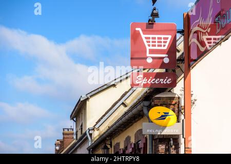 Signs of a local grocery store in a french village, serving also as a post office and a bakery. Stock Photo