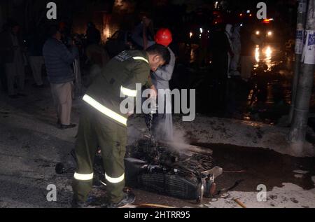 View of venue while security officials are cordon off the site for inspection and rescue operation is underway after a blast located on Fatima Jinnah road in Quetta on Wednesday, March 02, 2022. At least 25 people were injured and two people were killed after a blast struck Quetta's Fatima Jinnah Road. The blast took place near a police mobile and soon after the explosion, nearby shops caught fire. The Deputy Inspector-General (DIG) Quetta confirmed that a person has been illed in the blast while more than 10 have been injured. Stock Photo