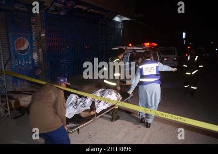 View of venue while security officials are cordon off the site for inspection and rescue operation is underway after a blast located on Fatima Jinnah road in Quetta on Wednesday, March 02, 2022. At least 25 people were injured and two people were killed after a blast struck Quetta's Fatima Jinnah Road. The blast took place near a police mobile and soon after the explosion, nearby shops caught fire. The Deputy Inspector-General (DIG) Quetta confirmed that a person has been illed in the blast while more than 10 have been injured. Stock Photo