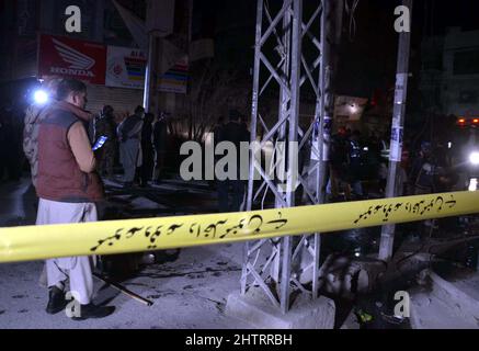 View of venue while security officials are cordon off the site for inspection and rescue operation is underway after a blast located on Fatima Jinnah road in Quetta on Wednesday, March 02, 2022. At least 25 people were injured and two people were killed after a blast struck Quetta's Fatima Jinnah Road. The blast took place near a police mobile and soon after the explosion, nearby shops caught fire. The Deputy Inspector-General (DIG) Quetta confirmed that a person has been illed in the blast while more than 10 have been injured. Stock Photo