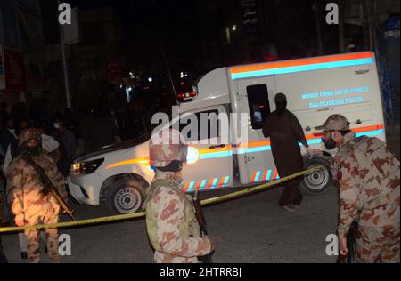 View of venue while security officials are cordon off the site for inspection and rescue operation is underway after a blast located on Fatima Jinnah road in Quetta on Wednesday, March 02, 2022. At least 25 people were injured and two people were killed after a blast struck Quetta's Fatima Jinnah Road. The blast took place near a police mobile and soon after the explosion, nearby shops caught fire. The Deputy Inspector-General (DIG) Quetta confirmed that a person has been illed in the blast while more than 10 have been injured. Stock Photo