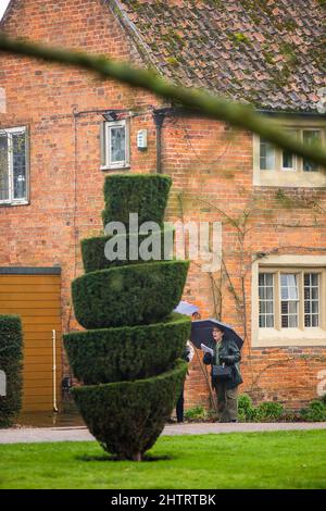 Doddington Hall, Lincoln , Lincolnshire,UK. 2nd Mar 2022.  UK Weather. A wet day at Doddington Hall spring bulb pageant. The spring bulb pageant was started in the 1950s. It is a Elizabethan manor house with Flemish tapestries and walled gardens plus a restaurant, cafe and shop. Credit: Windmill Images/Alamy Live News Stock Photo