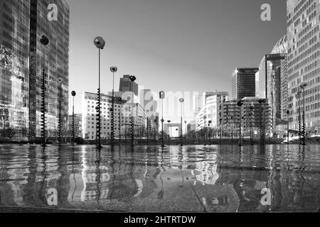 Paris, France - February 27, 2022 : A pool of water decorated with art at the famous business district La Défense in Paris in black and white Stock Photo