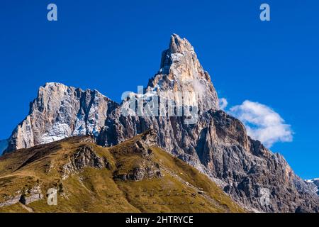 Cima di Vezzana (left) and Cimon della Pale (right), two of the main summits of the Pala group, seen from above Rolle Pass in autumn. Stock Photo