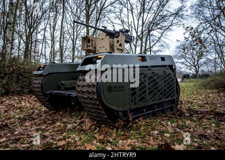 Army soldiers being trained to operate a Milrem Robotics THeMIs UGV Stock Photo