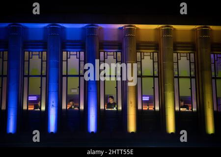 London, UK. 2nd March 2022.  The Hammersmith Apollo in West London, is lit up in the Ukrainian national colours of blue and yellow  in support of the country following the recent invasion by Russian forces. Credit: Kiki Streitberger/Alamy Live News Stock Photo