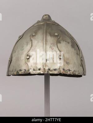 Art inspired by Helmet, 16th–18th century, Tibetan, Steel, H. 6 3/8 in. (16.2 cm); W. 8 1/4 in. (21 cm); D. 8 7/8 in. (22.5 cm); Wt. 2 lb. 1.7 oz. (955.4 g), Helmets, Classic works modernized by Artotop with a splash of modernity. Shapes, color and value, eye-catching visual impact on art. Emotions through freedom of artworks in a contemporary way. A timeless message pursuing a wildly creative new direction. Artists turning to the digital medium and creating the Artotop NFT Stock Photo