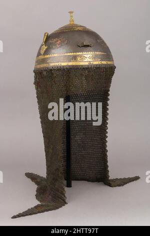 Art inspired by Helmet, 17th–18th century, Indian, Steel, gold, H. including mail 24 in. (61 cm); H. excluding mail 5 1/4 in. (13.3 cm); Diam. 7 3/4 in. (19.7 cm); Wt. 3 lb. 0.4 oz. (1372.1 g), Helmets, Classic works modernized by Artotop with a splash of modernity. Shapes, color and value, eye-catching visual impact on art. Emotions through freedom of artworks in a contemporary way. A timeless message pursuing a wildly creative new direction. Artists turning to the digital medium and creating the Artotop NFT Stock Photo