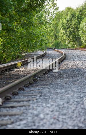 low down shot of railway tracks leading into the distance Stock Photo