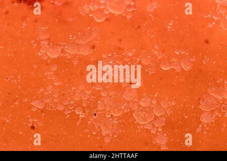 Close-up of an oily substance that has bubbles inside and is orange in color Stock Photo