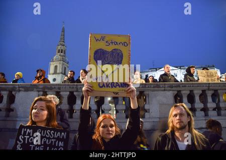 London, England, UK. 2nd Mar, 2022. A protester holds a 'We Stand With Ukraine' placard. Hundreds of people gathered in Trafalgar Square for the eighth day of protests, as the war in Ukraine continues. (Credit Image: © Vuk Valcic/ZUMA Press Wire) Credit: ZUMA Press, Inc./Alamy Live News Stock Photo