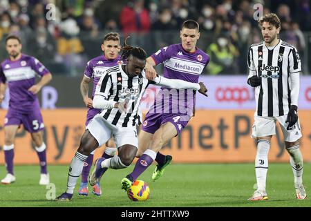 Florence, Italy. 21st May, 2022. Moise Kean of Juventus FC and Nikola  Milenkovic of ACF Fiorentina compete for the ball during the Serie A  2021/2022 football match between ACF Fiorentina and Juventus