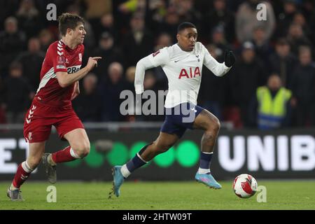 MIDDLESBROUGH, UK. MAR 1ST Tottenham Hotspur's Steven Bergwijn in action with Middlesbrough's Paddy McNair during the FA Cup Fifth Round match between Middlesbrough and Tottenham Hotspur at the Riverside Stadium, Middlesbrough on Tuesday 1st March 2022. (Credit: Mark Fletcher | MI News) Credit: MI News & Sport /Alamy Live News Stock Photo