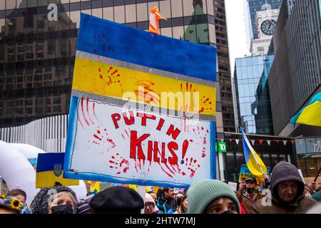 Vancouver, Canada - February 26,2022: View of sign Putin KIlls during the rally against invasion of Ukraine in front of Vancouver Art Gallery Stock Photo