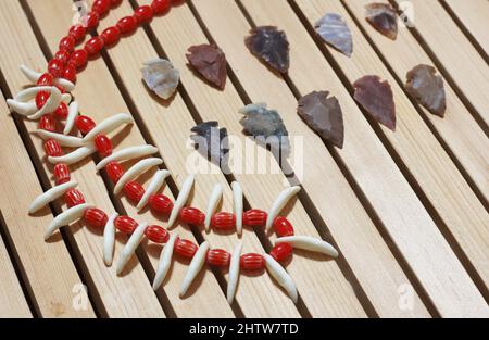 Native American Arrowheads and Bead Necklace With Coyote Teeth Stock Photo