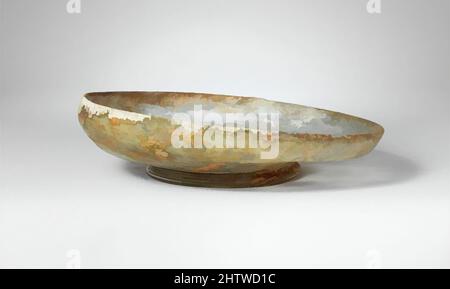 Art inspired by Glass dish, Late Imperial, 4th century A.D., Roman, Glass; blown, Height: 1 5/8 in. (4.1 cm), Glass, Colorless with blue green tinge. Slightly inverted, rounded rim; short side to body, curving in to tubular, integral base ring; almost flat bottom, thickened at center, Classic works modernized by Artotop with a splash of modernity. Shapes, color and value, eye-catching visual impact on art. Emotions through freedom of artworks in a contemporary way. A timeless message pursuing a wildly creative new direction. Artists turning to the digital medium and creating the Artotop NFT Stock Photo