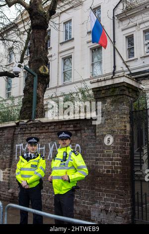 London, UK - March 2nd 2022: Police officers outside the Russian Embassy in London, UK. Stock Photo